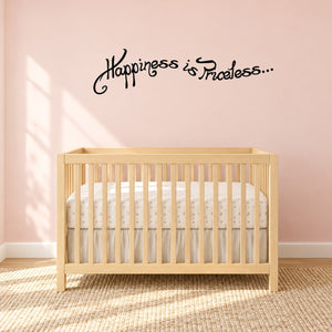 Wall decal with "Happiness is Priceless..." in black cursive lettering