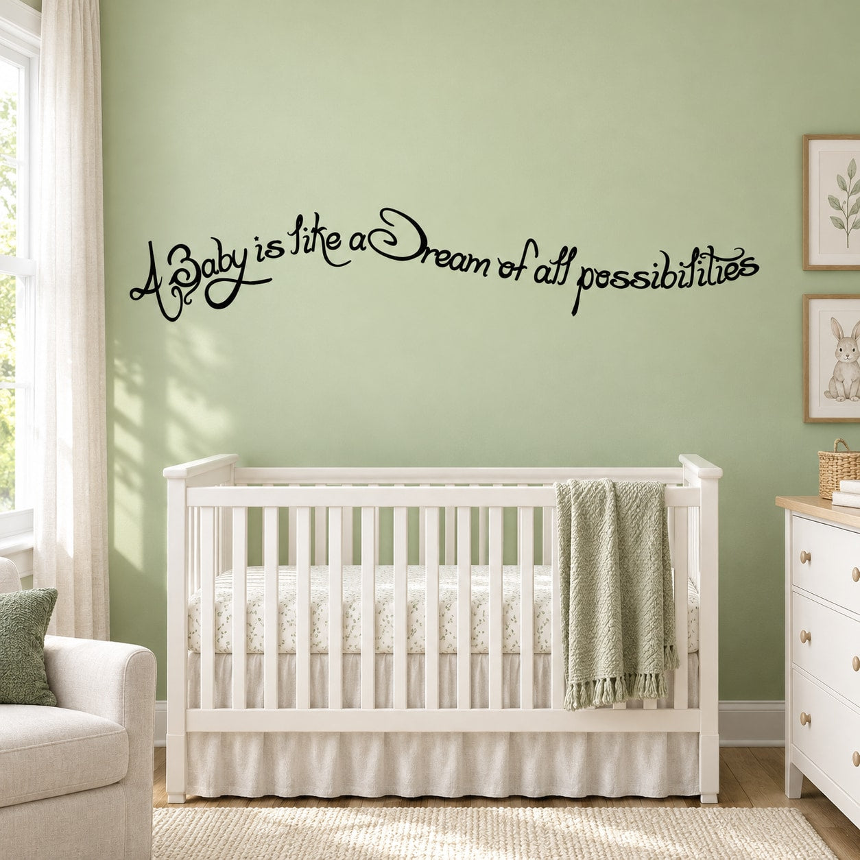 Nursery wall decal with cursive quote: 'Baby is like a Dream of all possibilities'