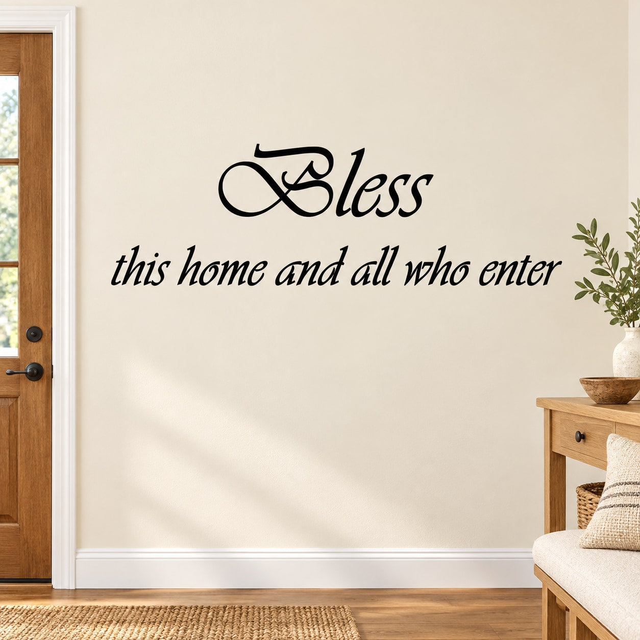 Wall decal with cursive "Bless this home and all who enter" lettering