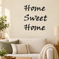 Home sweet home wall decal with black cursive text reading “Home Sweet Home”
