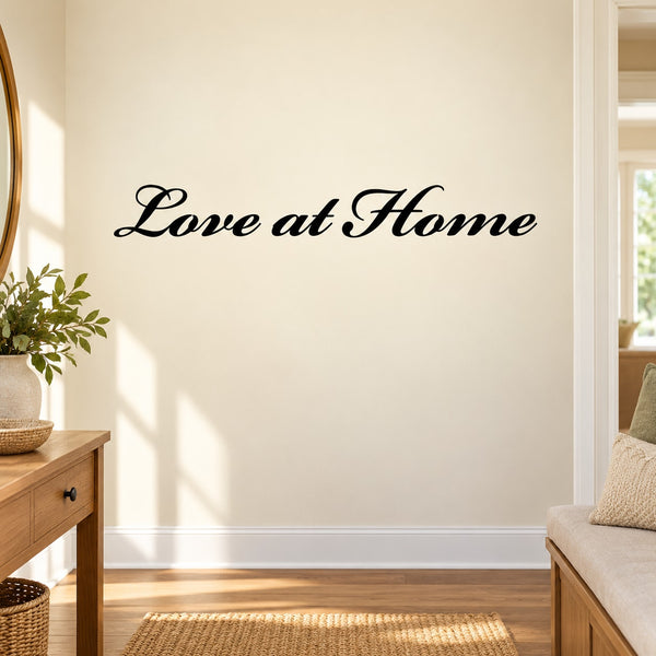 Wall decal with "Love at Home" in black script lettering