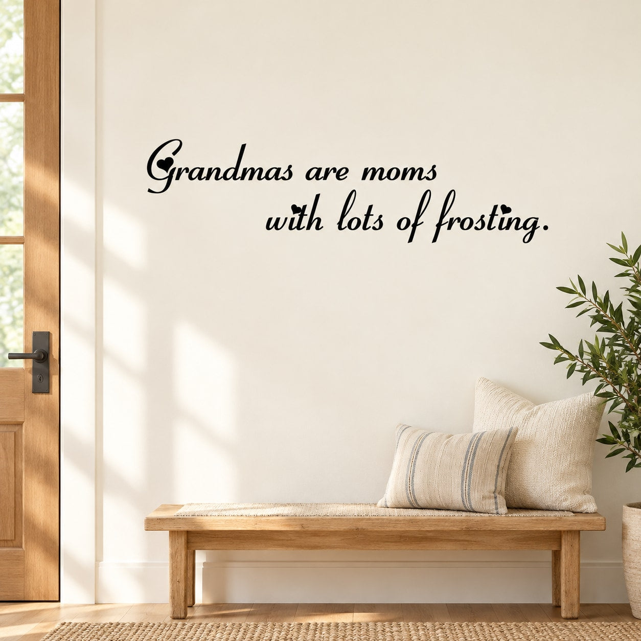 Wall decal with script text: “Grandmas are moms with lots of frosting.”