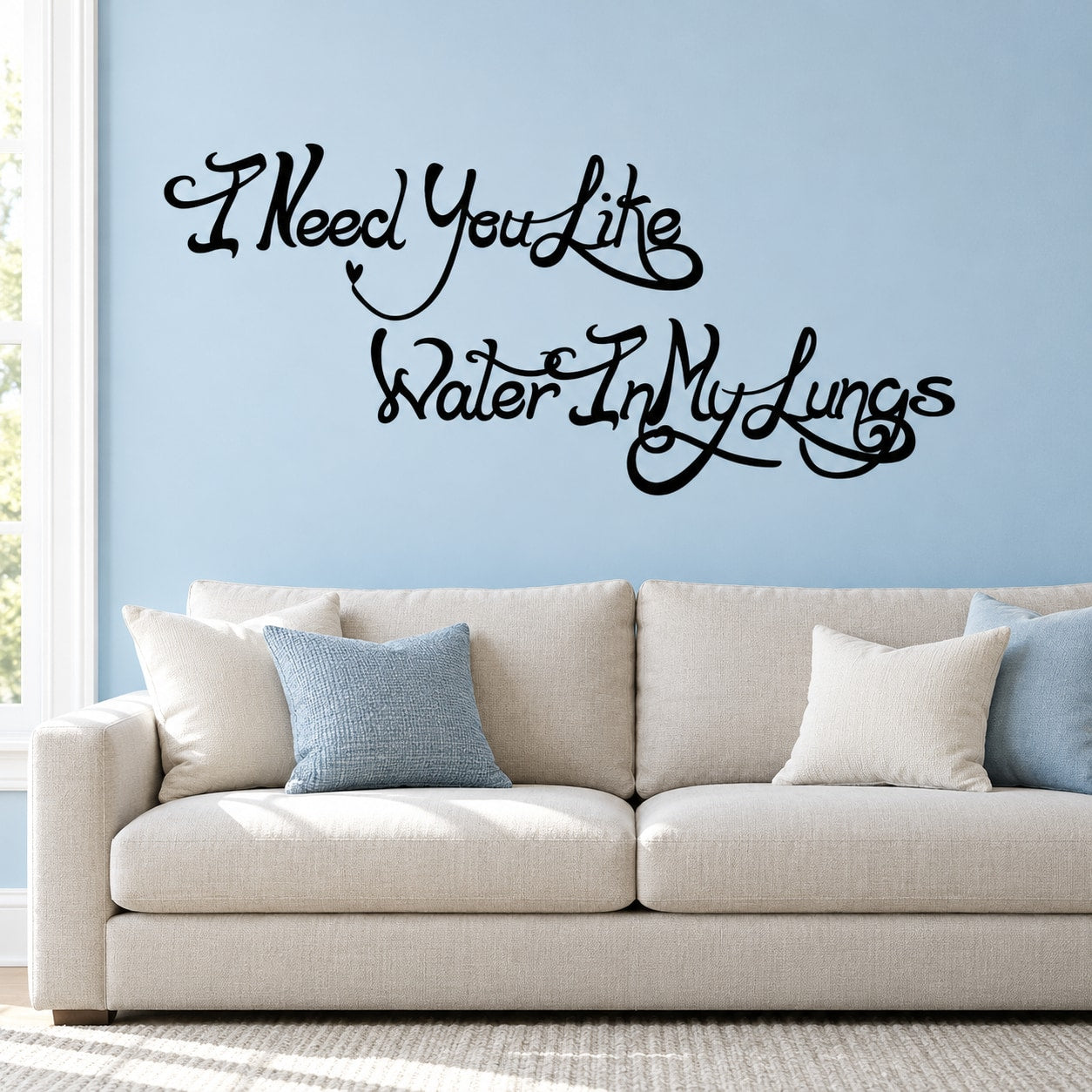 Wall decal with black cursive text: "I Need You Like Water In My Lungs"