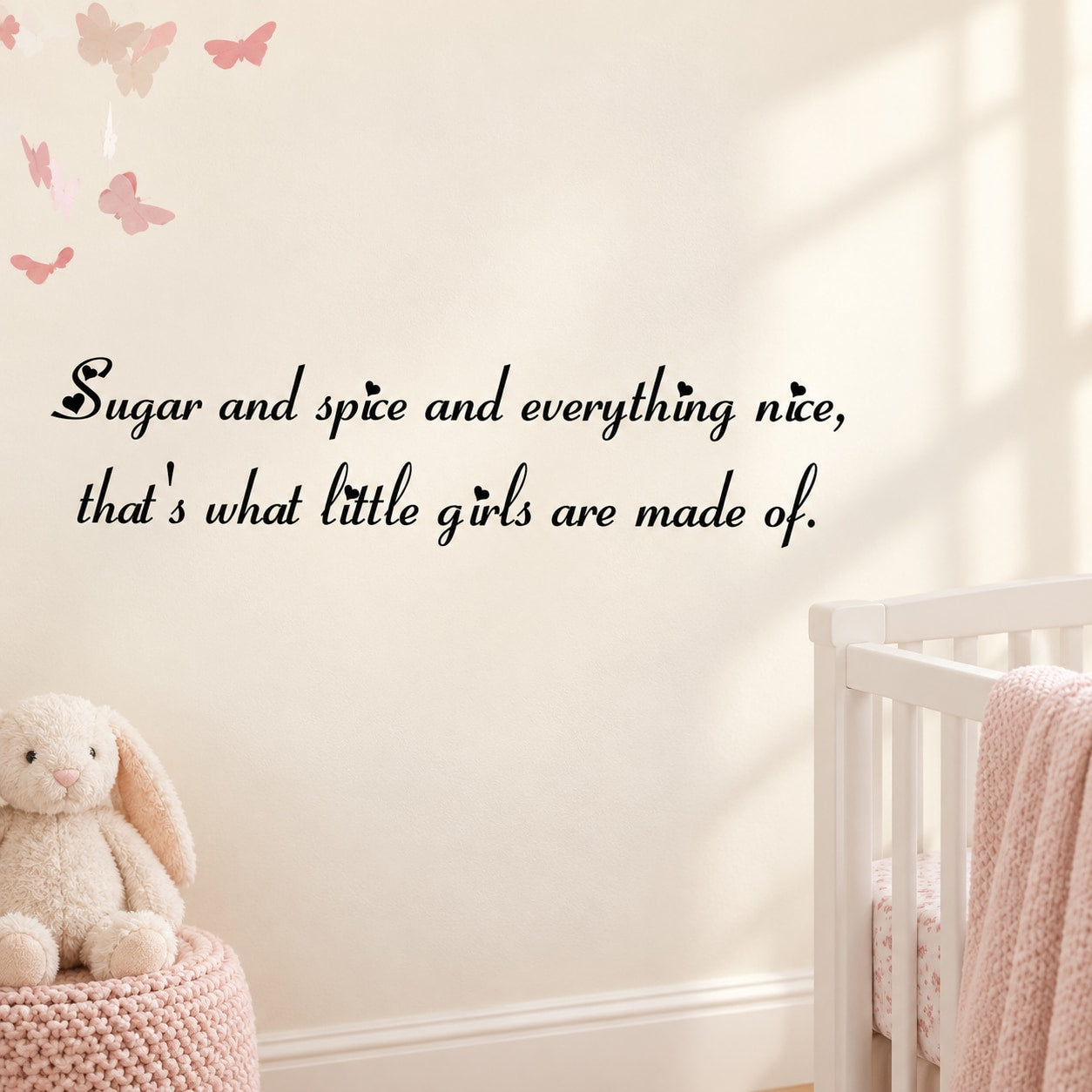 Nursery wall decal with cursive quote: Sugar and spice and everything nice