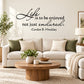 Black script quote wall decal: “Life is to be enjoyed, not just endured.”
