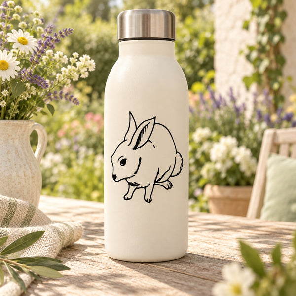 Cream bottle with black bunny decal, sitting rabbit face illustration