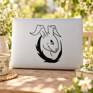 Mischievous rabbit decal with black outline on light surface