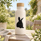 White water bottle with black resting rabbit decal and bamboo lid