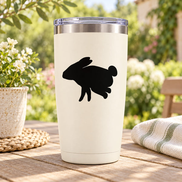 Black hopping rabbit decal on white tumbler cup