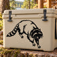 Raccoon digging decal, black and white graphic on a beige cooler