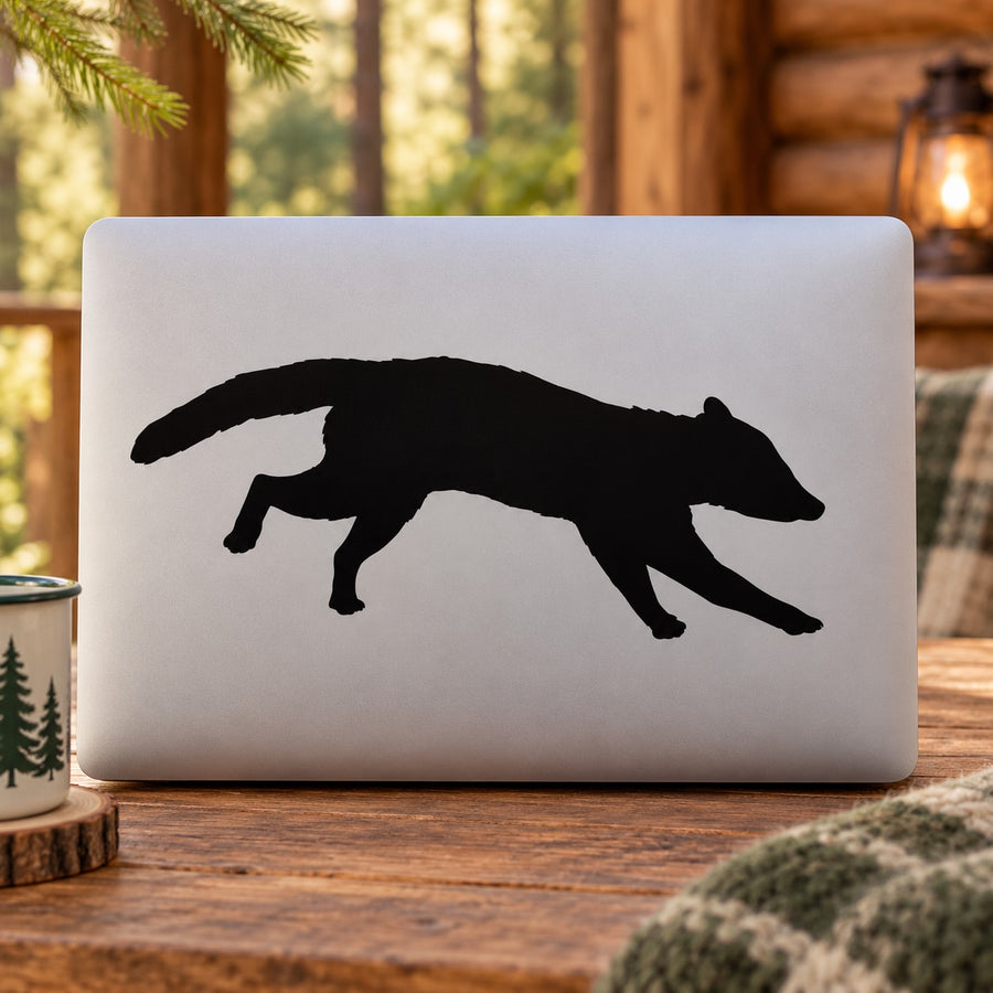 Running raccoon silhouette decal in black on light laptop lid