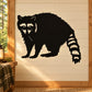 Black raccoon directly staring wall decal with raised striped tail