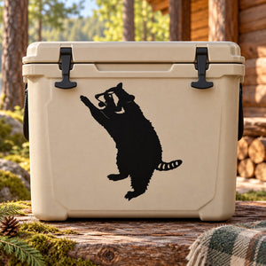Leaping raccoon decal, black silhouette on beige rectangular surface
