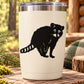 Black raccoon sitting and watching decal sticker