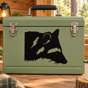Raccoon head decal, black silhouette on olive green rectangular surface