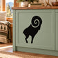 Black ram horn decal with simple swirl graphic on a light cabinet panel