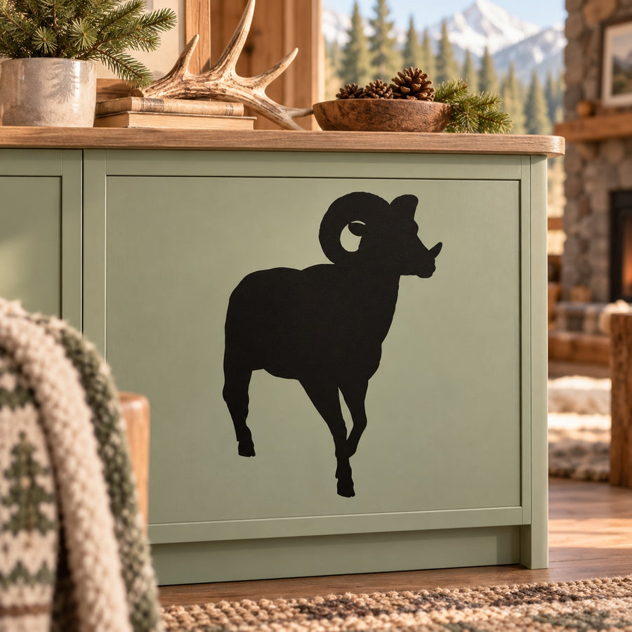 Ram silhouette decal with black walking ram design on a light green cabinet