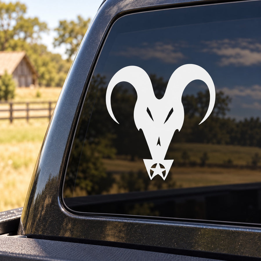 White goat head decal with star ornament on car window