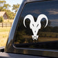 White goat head decal with star ornament on car window