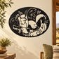 Animal motif oval decal with black background and white animal silhouettes
