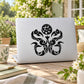 Abstract sea birds and conch decal sticker, black illustration on light backing.
