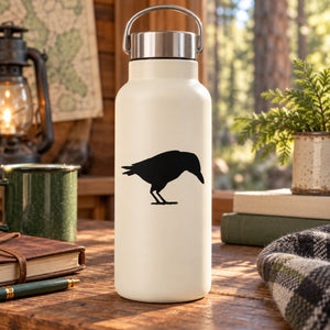 White water bottle with black crow silhouette decal and stainless steel lid