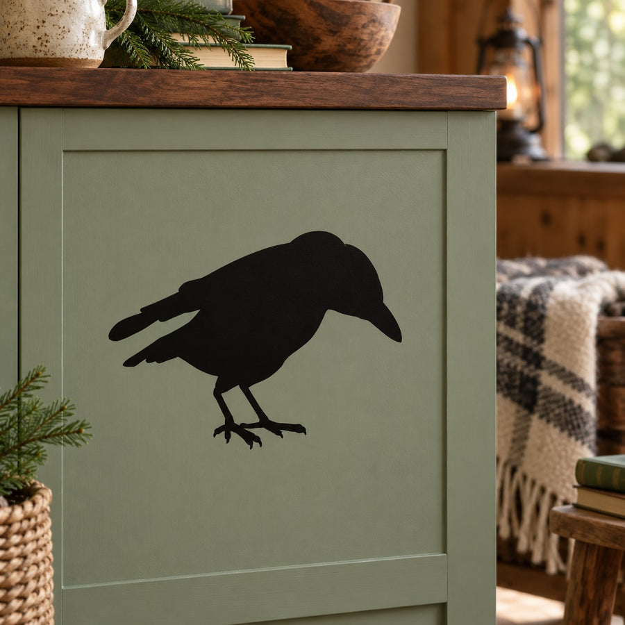 Startled crow silhouette decal, black bird outline on a light surface