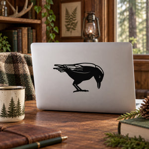 Pecking crow silhouette vinyl decal, black bird design on light background
