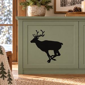 Sprinting reindeer silhouette wall decal on green panel