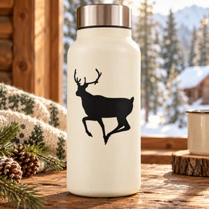 White tumbler bottle with black turning reindeer decal