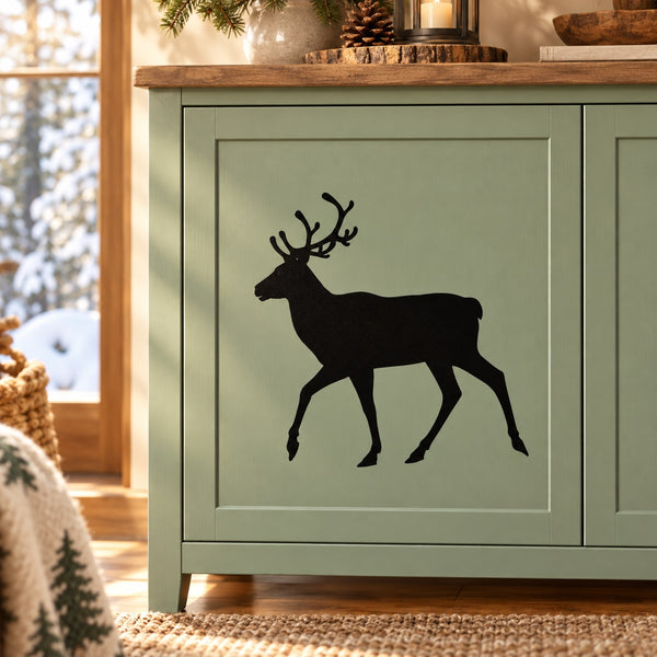 Walking reindeer silhouette decal, black on light background, cutout style