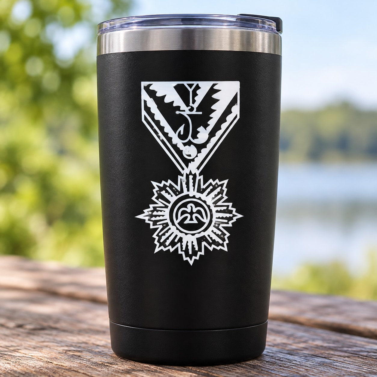 Black tumbler with white priest medallion decal and cross emblem