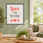 Square printed die-cut wall decal with 'Love One Another' typography and red hearts