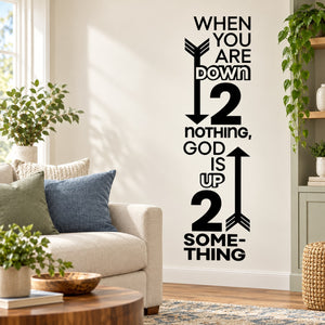 Black wall decal with arrowed quote: “When you are down… God is up… some thing”