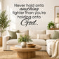 Inspirational wall decal with script quote about holding on to God, black lettering