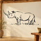 Black outline rhino wall decal with grass detail and long horn