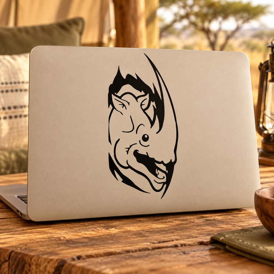 Smiling rhino peeking decal, black line-art head on a light laptop lid