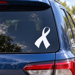 White awareness ribbon decal with curved rightward tail on a car window