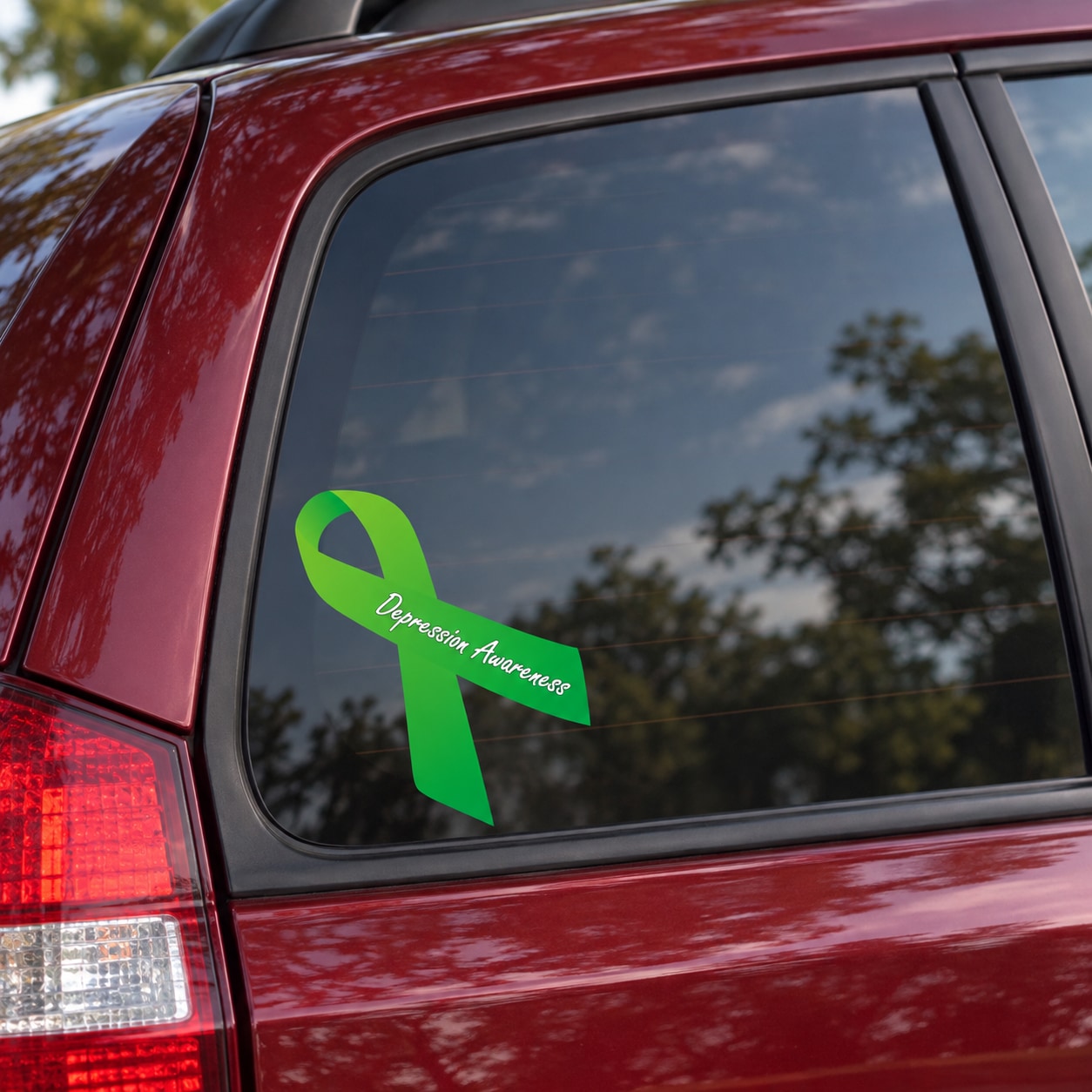 Depression awareness ribbon vinyl sticker: green ribbon with “Depression Awareness” text on window