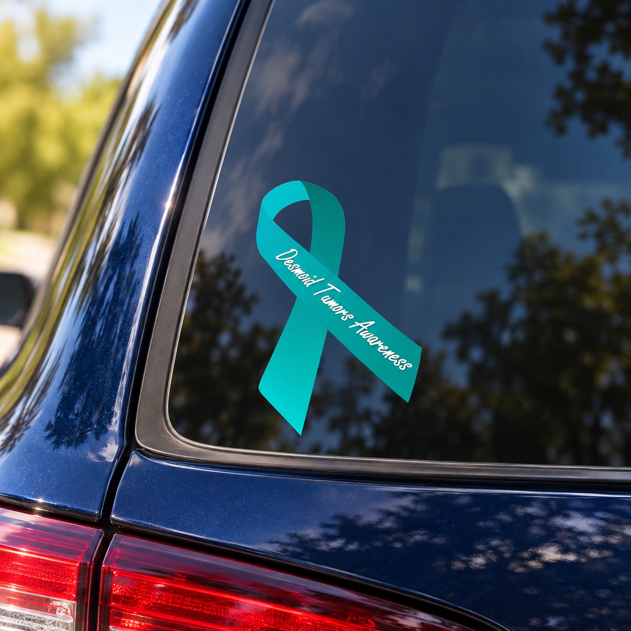 Teal awareness ribbon vinyl sticker with printed message on a car window