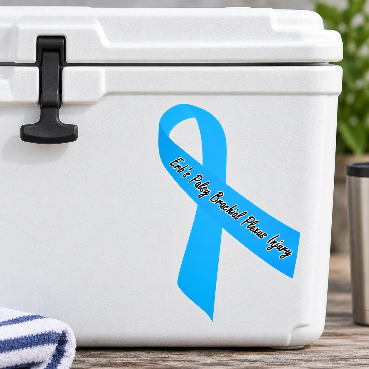 Blue awareness ribbon vinyl sticker with black cursive text on white surface