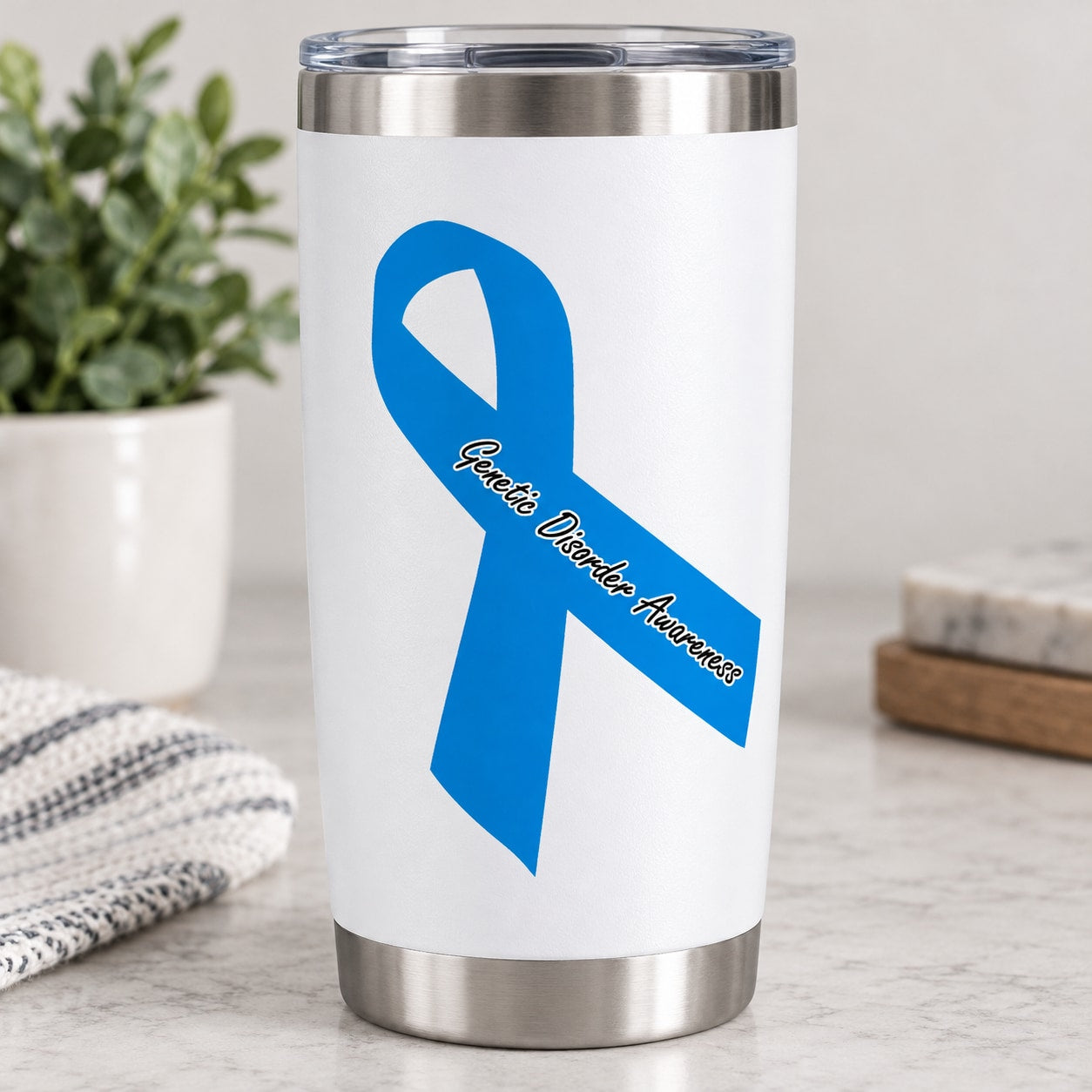 Blue awareness ribbon vinyl sticker on white surface with cursive message strip