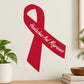Red vinyl awareness ribbon sticker with white center and cursive “Headaches and Migraines”