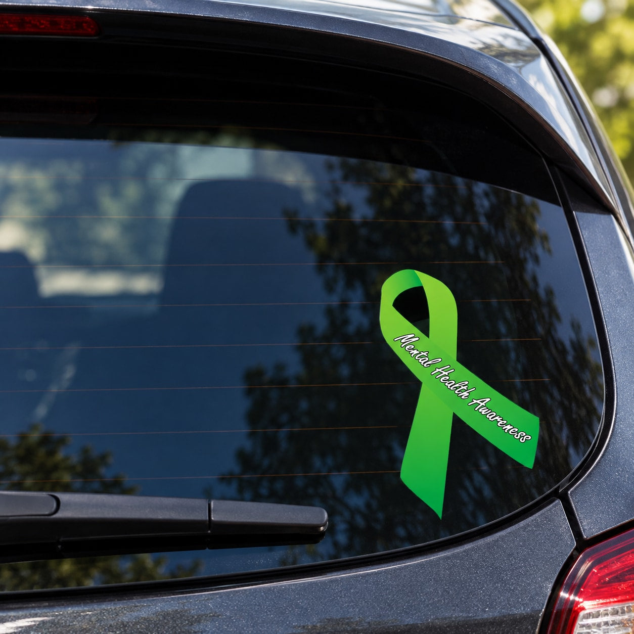 Mental health awareness ribbon vinyl sticker on car window, green ribbon with text