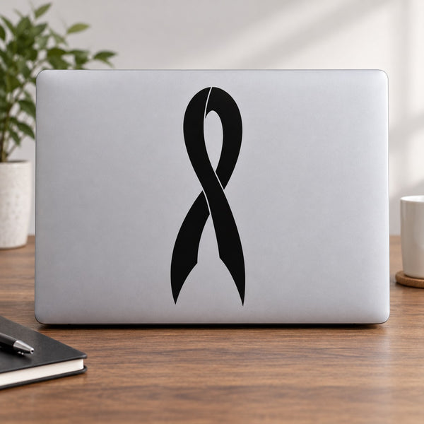 Black awareness ribbon decal on light gray laptop cover