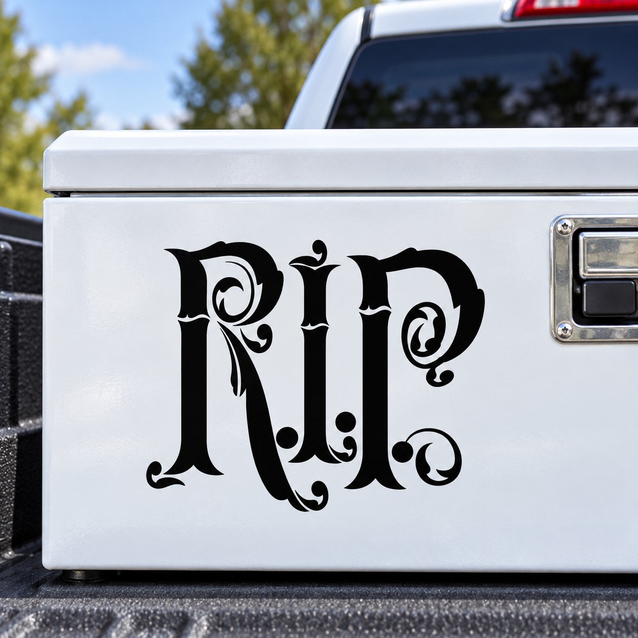 Black ornate RIP decal on a white rectangular panel
