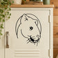 Black line-art rodent head decal with smiling face, whiskers, and nose