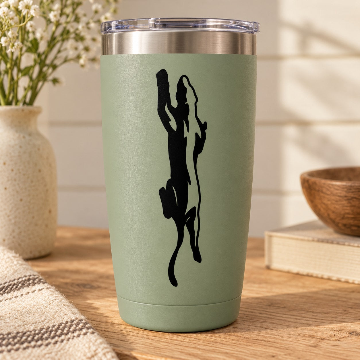 Mint green tumbler with black panther decal
