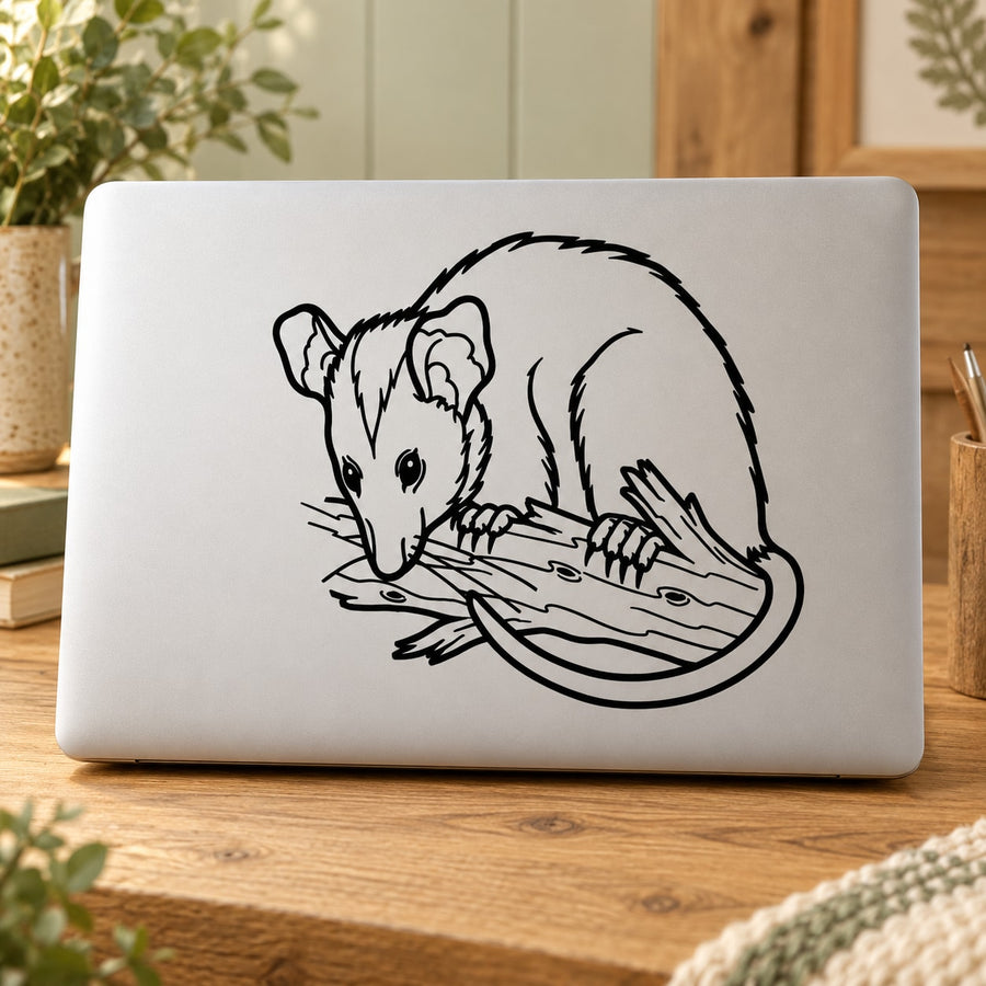 Rodent branch decal with black-and-white mouse illustration on pale surface