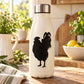 Rooster silhouette decal on white bottle, black standing bird graphic